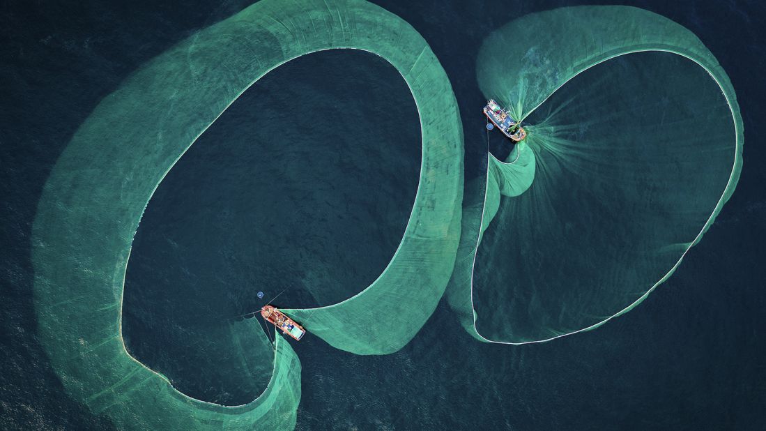 Thien Nguyen Ngoc's aerial photograph of anchovy fishing off the coast of Hon Yen in Vietnam has won him the Save Our Seas Foundation Marine Conservation Photographer of the Year 2022 award. Salted anchovy is a key ingredient in traditional Vietnamese fish sauce but when anchovies are overfished, whales, tuna, sea birds and other marine predators whose diets rely on them face starvation and population decline. 
