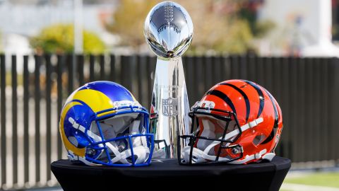 The Vince Lombardi Trophy with helmets from the Los Angeles Rams and Cincinnati Bengals.