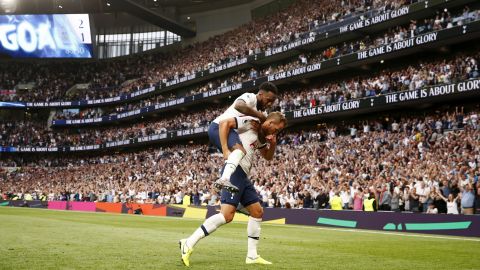 Harry Kane of Tottenham Hotspur celebrates with teammate Danny Rose after scoring his team's second goal during the Premier League match between Tottenham Hotspur and Aston Villa at Tottenham Hotspur Stadium on August 10, 2019 in London.