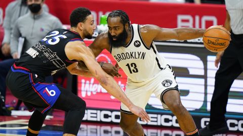 James Harden tries to drive past Ben Simmons during the second half of a game on Saturday, February 6, 2021.