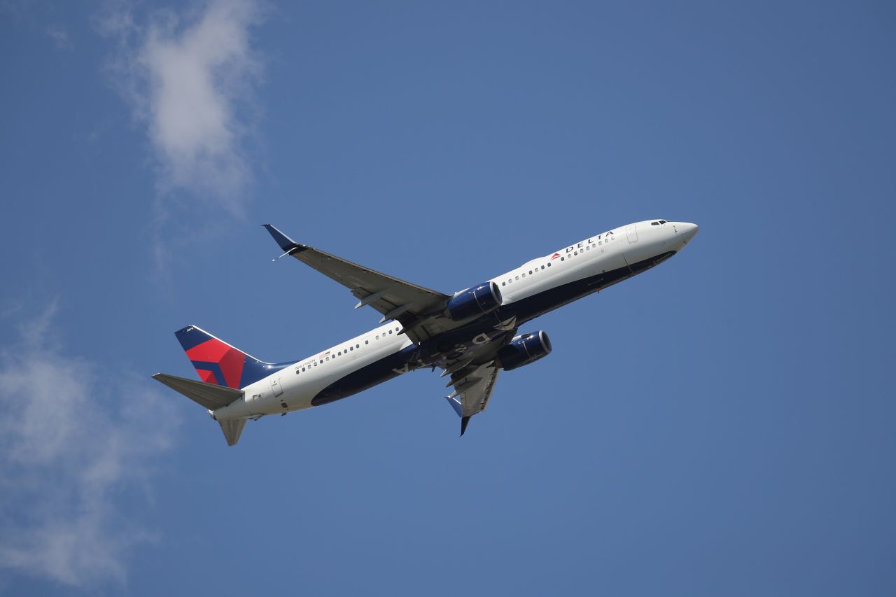 A Boeing 737-932ER operated by Delta takes off from JFK International Airport. AAA says only about 7% of people traveling for the July 4 holiday will be flying.