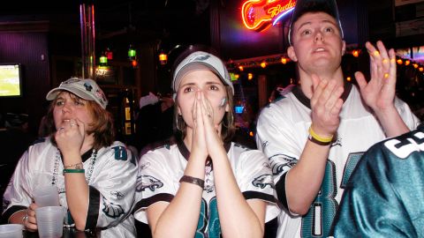 Fans at Chickie's and Pete's bar and restaurant in Philadelphia react after the Philadelphia Eagles were defeated by the New England Patriots in Super Bowl XXXIX February 6, 2005.  (Photo by William Thomas Cain/Getty Images)