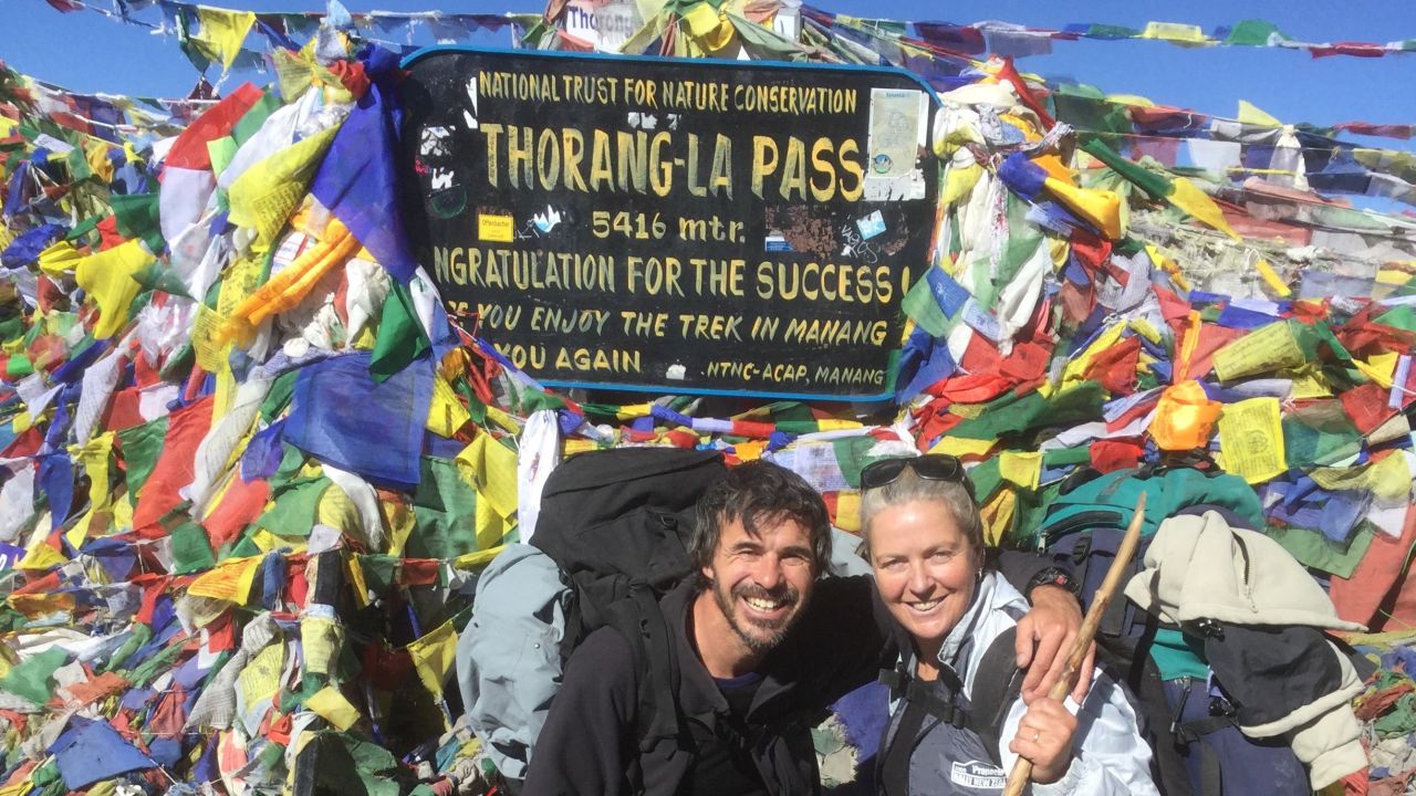 <strong>Return to Nepal: </strong>Mandy and Lee say years of saving allowed them to retire in 2017, when they were in their late 40s. Their first post-retirement trip was to Nepal, to follow in the footsteps of their younger selves. Here they are at the Thorong La Pass in Nepal in 2017.