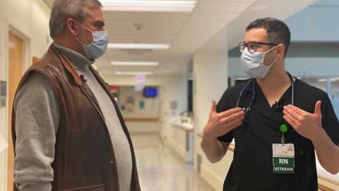 Mark Schimmelpfennig (left), seen here with nurse David Bracho, is using techniques from the military to help nurses deal with PTSD, grief and trauma.
