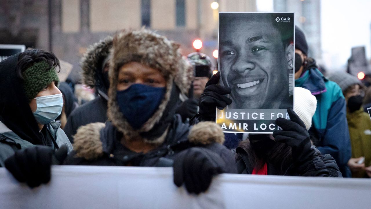 A demonstrator holds a photo of Amir Locke during a rally February 5 in Minneapolis.