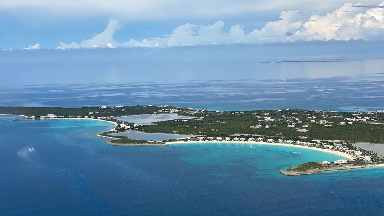 From the air, passengers see the southwest tip of Anguilla, with the long sandy curve of Maundays Bay.