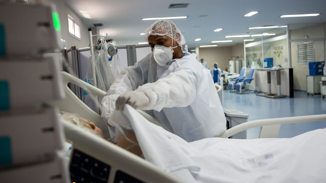 An ICU nurse in Marica, Brazil tends to a Covid-19 patient in January.