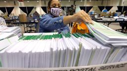 Harris County election worker Romanique Tillman prepares mail-in ballots to be sent out to voters Tuesday, Sept. 29, 2020, in Houston. (AP Photo/David J. Phillip)