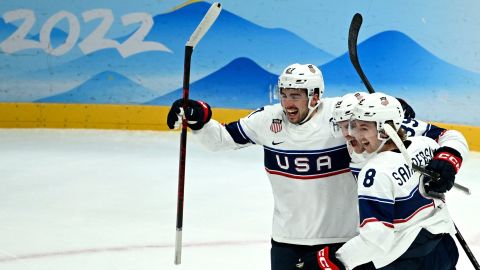 USA's players celebrate scoring against Canada. 