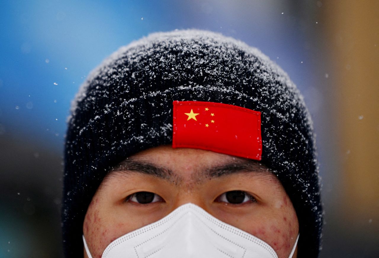 A man attends a freestyle skiing event that was postponed because of <a href="https://www.cnn.com/world/live-news/beijing-winter-olympics-02-13-22-spt/h_79912fabddc27a4d4b7d201f61fd125a" target="_blank">poor weather conditions.</a>