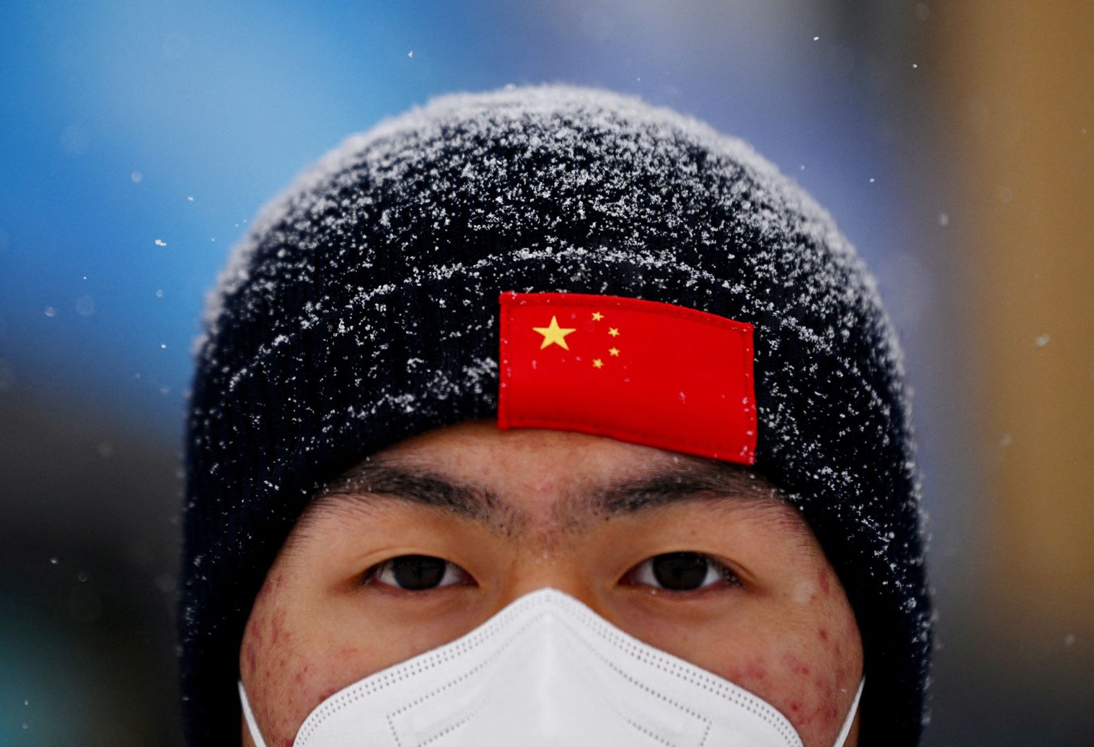 A man attends a freestyle skiing event that was postponed because of <a href="https://www.cnn.com/world/live-news/beijing-winter-olympics-02-13-22-spt/h_79912fabddc27a4d4b7d201f61fd125a" target="_blank">poor weather conditions.</a>