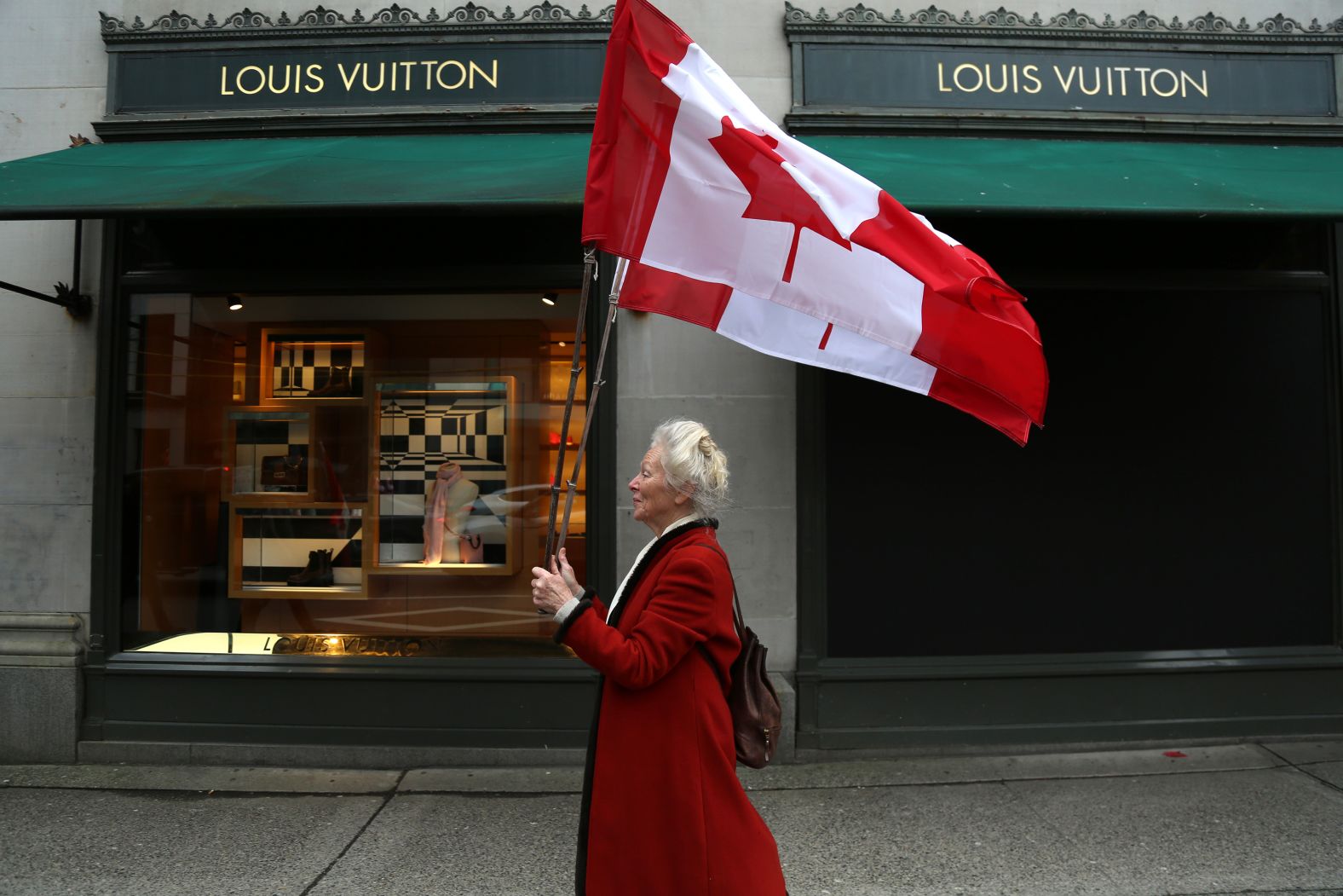 A protester walks to a demonstration in Vancouver, British Columbia, on February 5.