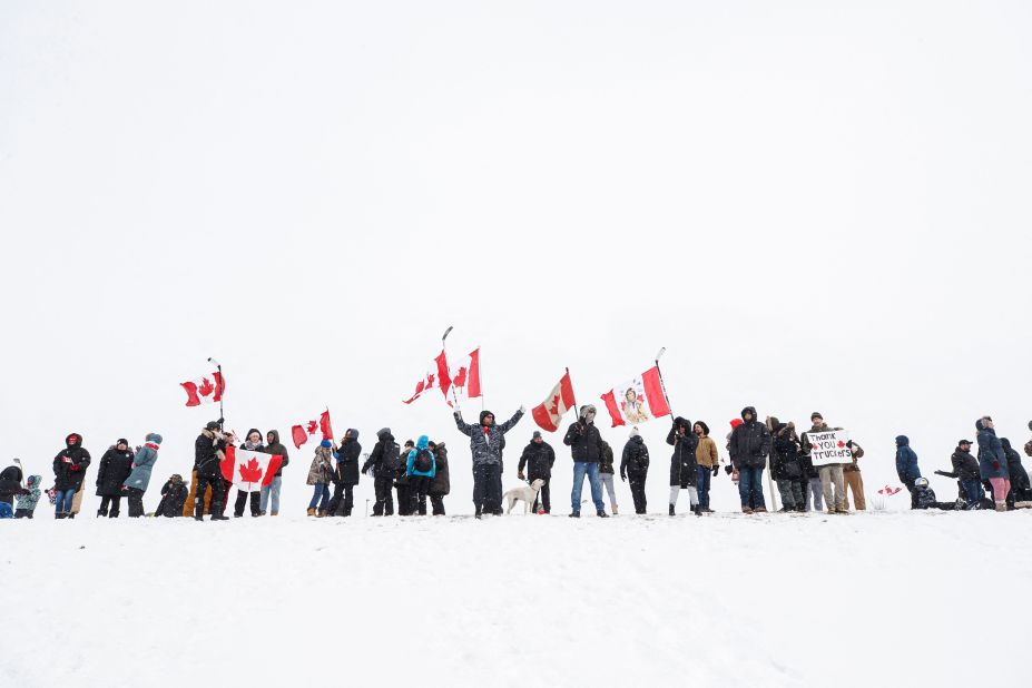 Supporters of the truckers gather near a highway overpass outside of Toronto on January 27.