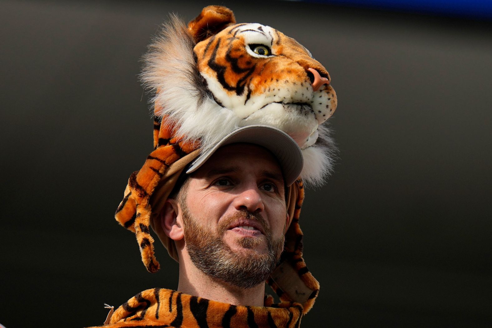 A Bengals fan watches pregame warmups.