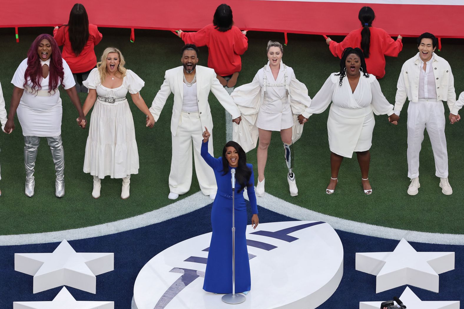 Country star Mickey Guyton sings the National Anthem before the game.