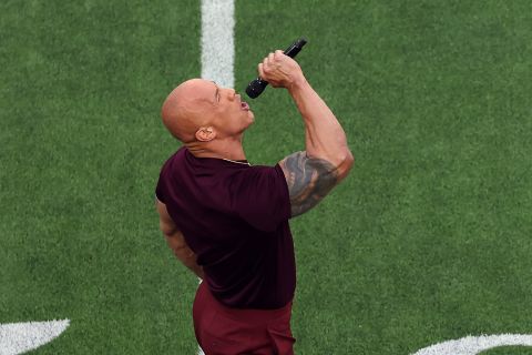 Actor Dwayne "The Rock" Johnson introduces the two teams before kickoff.