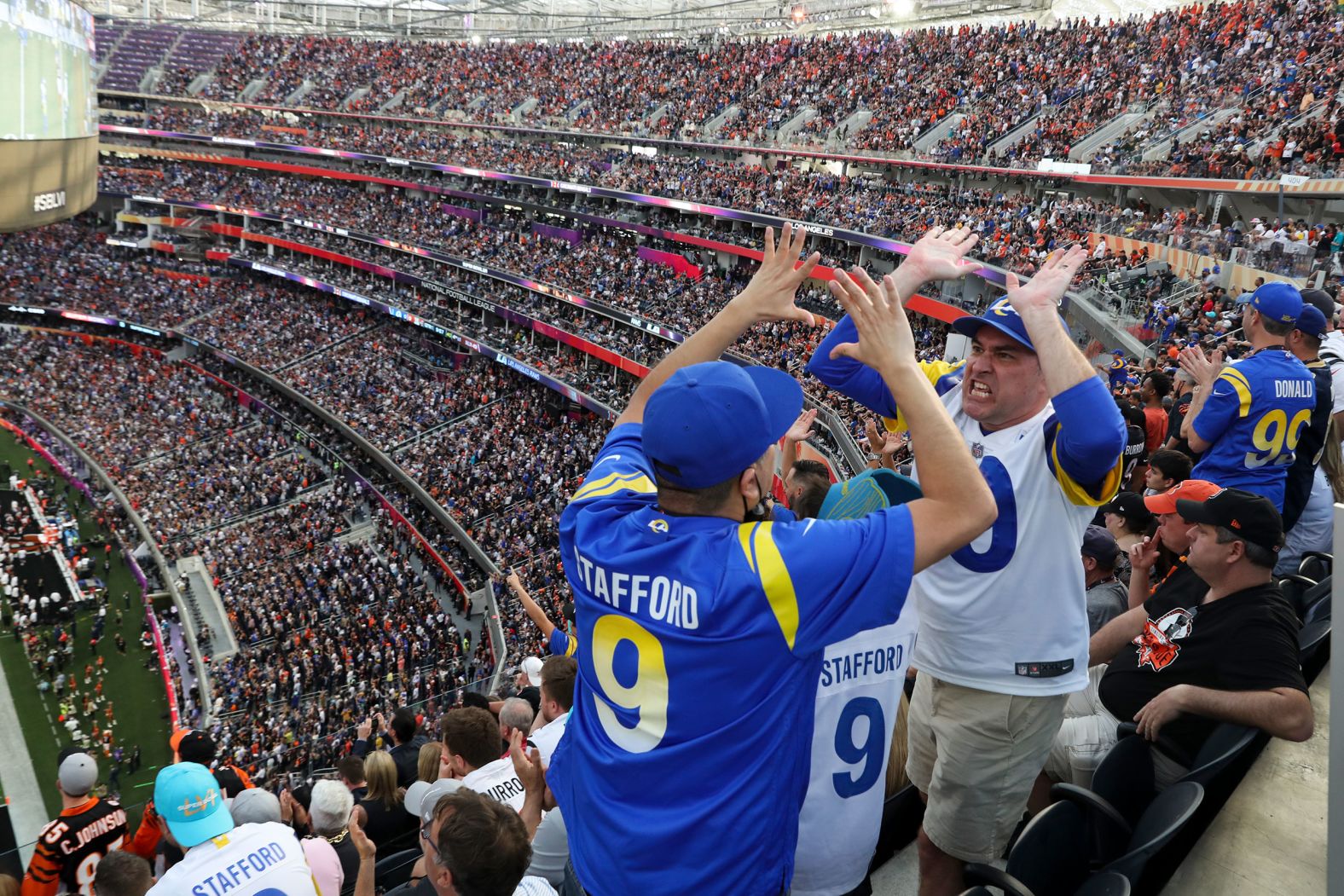 Fans cheer during the game.