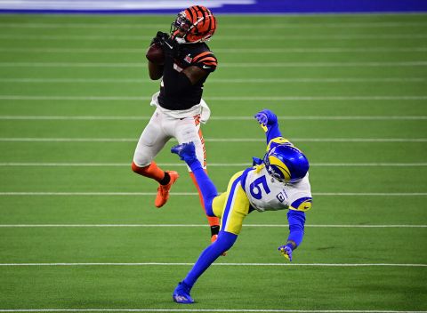 Bengals wide receiver Tee Higgins pulls in a catch over Jalen Ramsey to score a third-quarter touchdown and give the Bengals the lead. The 75-yard touchdown was the first play from scrimmage in the second half.
