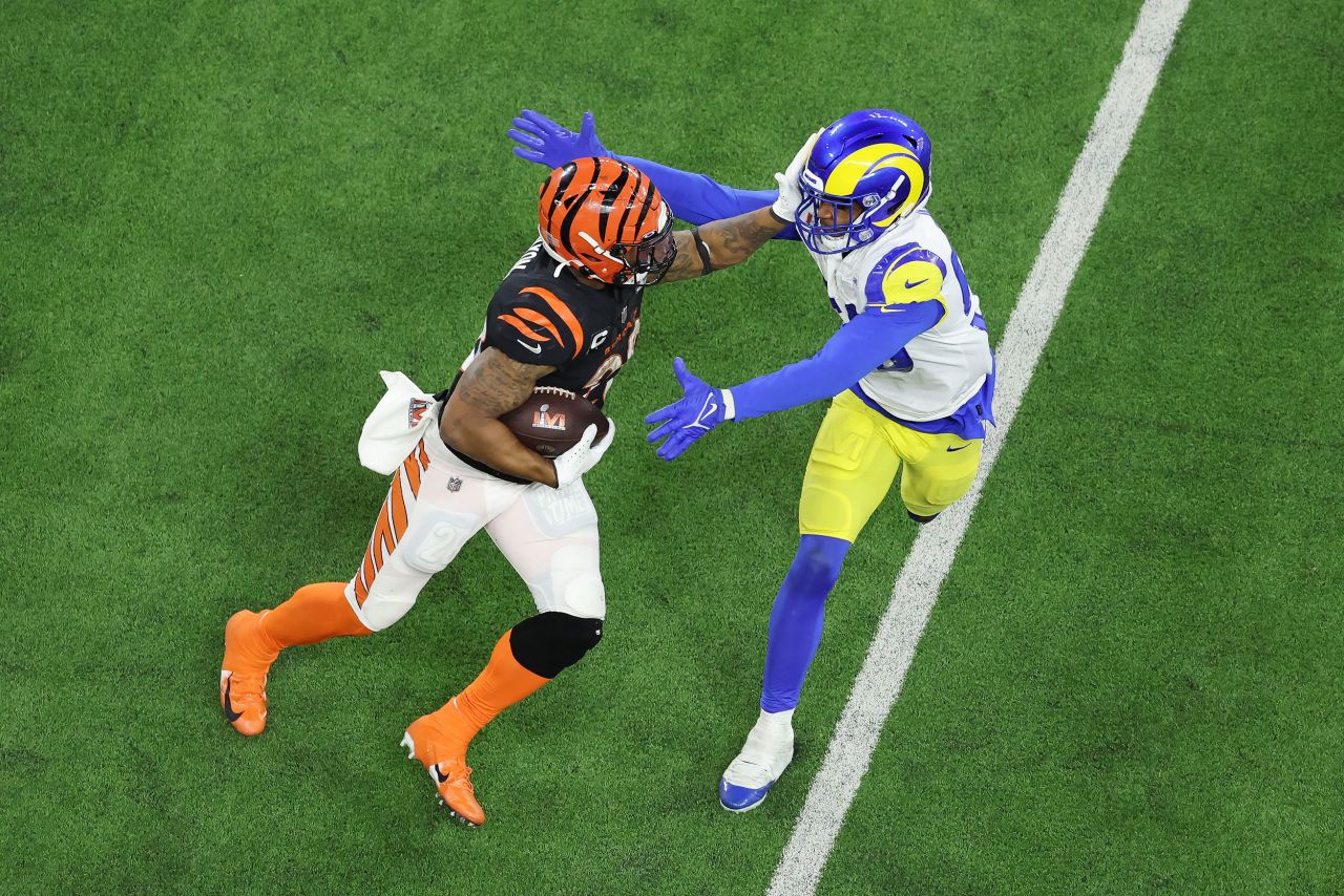 Bengals running back Joe Mixon tries to fend off a Rams defender in the second half.