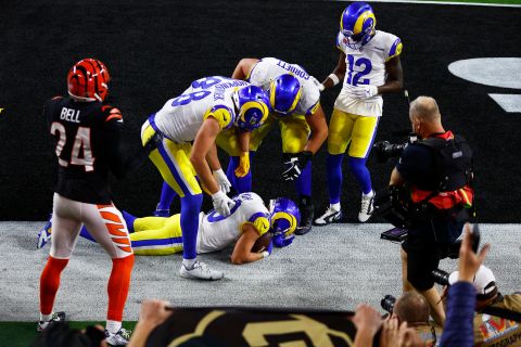 Kupp is surrounded by teammates after making a catch in the end zone on the game-winning drive. That touchdown was overturned by a penalty, but Kupp caught another one a few plays later.
