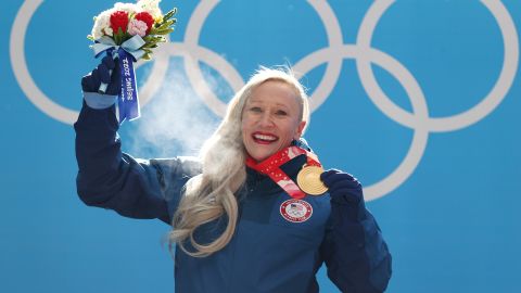 Kaillie Humphries poses after winning gold for Team USA at Beijing 2022.