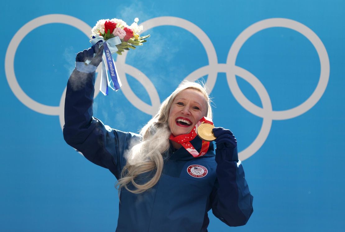 There's nothing quite like that gold medal winning feeling ... Humphries poses during the women's monobob bobsled medal ceremony on day 10 of Beijing 2022 Winter Olympic Games.