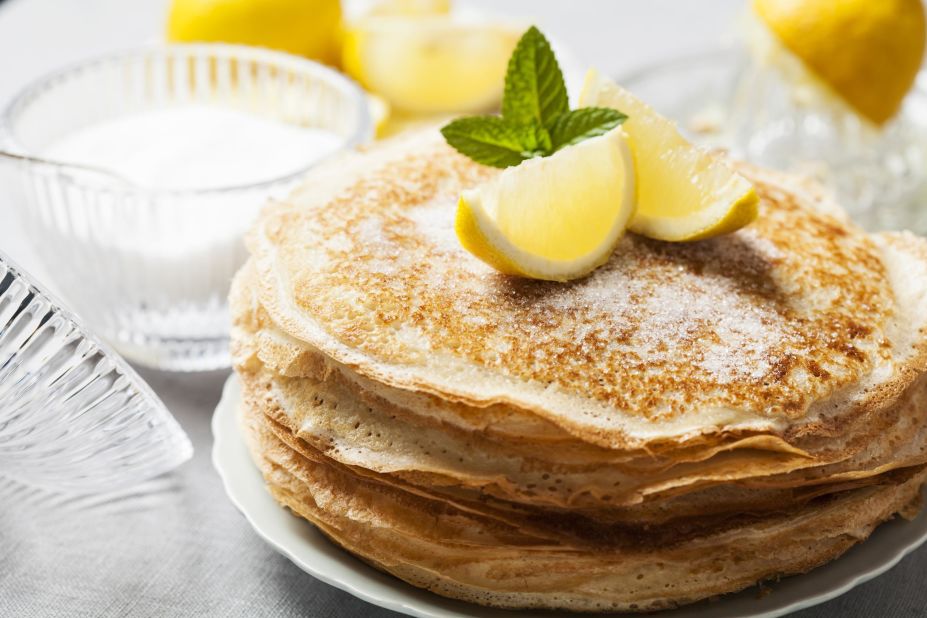 <strong>Sugar and lemon pancakes, England:</strong> Traditional English pancakes are about as far away from the maple syrup-covered stacks beloved in the US as it gets.