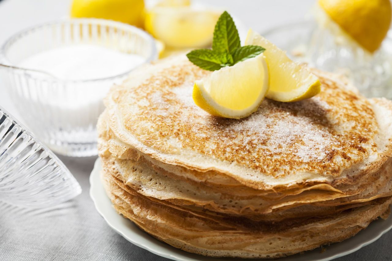 Traditional English pancakes are typically served with lemon and sugar.