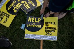 Michelle Wong makes a sign during a rally in support of the San Francisco School Board recall at Carl Larsen Park, San Francisco, Saturday, February 12, 2022.