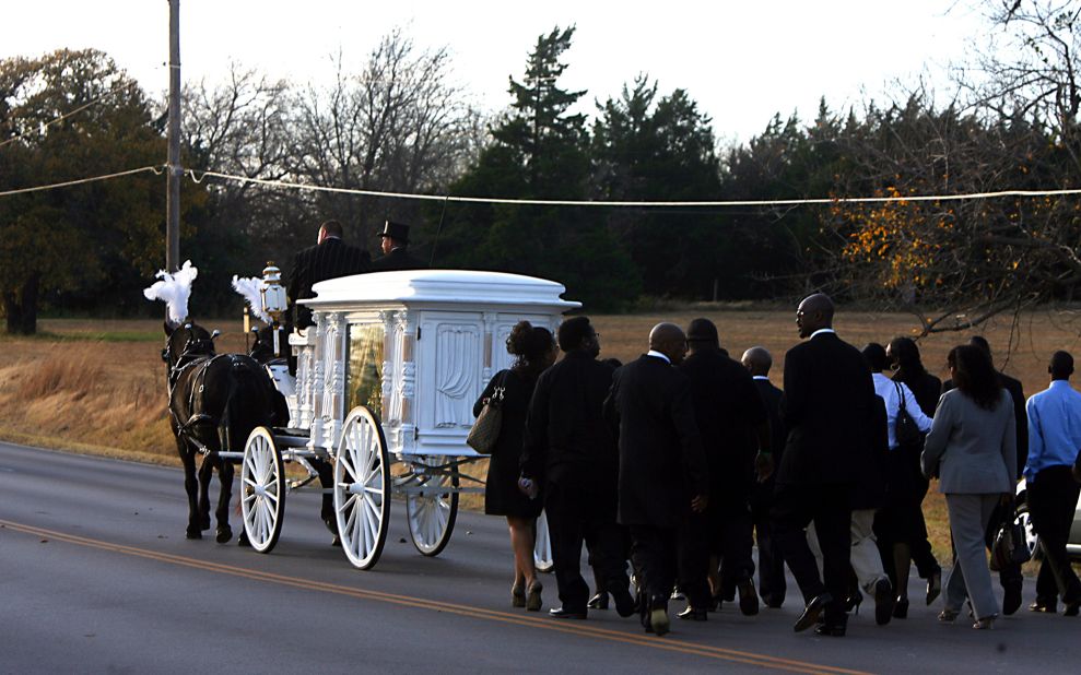 The funeral for West's mother, Donda, is held in Spencer, Oklahoma, in 2007. She died at the age of 58.