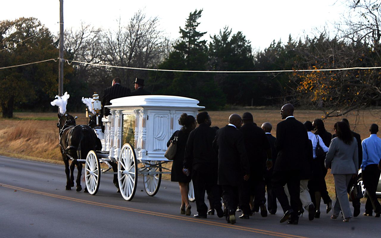 The funeral for West's mother, Donda, is held in Spencer, Oklahoma, in 2007. She died at the age of 58.