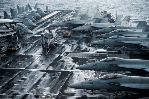 F/A-18E and 18F Super Hornets are seen on the flight deck of the USS Harry S. Truman, an American aircraft carrier in the Adriatic Sea on February 14. The Truman was on its way to the Middle East in mid-December, but the Pentagon <a href=