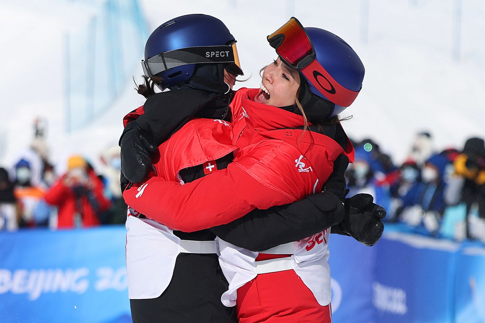 Swiss freestyle skier Mathilde Gremaud, left, hugs China's Eileen Gu after <a href="index.php?page=&url=https%3A%2F%2Fwww.cnn.com%2Fworld%2Flive-news%2Fbeijing-winter-olympics-02-15-22-spt%2Fh_37c061d273dbb25165e83ba6fb203dd2" target="_blank">they finished 1-2 in the slopestyle finals</a> on February 15. Gremaud won gold and Gu won silver.