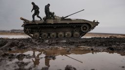 Ukrainian servicemen walk on an armored fighting vehicle during an exercise in a Joint Forces Operation controlled area in the Donetsk region, eastern Ukraine, Thursday, Feb. 10, 2022. A peace agreement for the separatist conflict in eastern Ukraine that has never quite ended is back in the spotlight amid a Russian military buildup near the country's borders and rising tensions about whether Moscow will invade.(AP Photo/Vadim Ghirda)