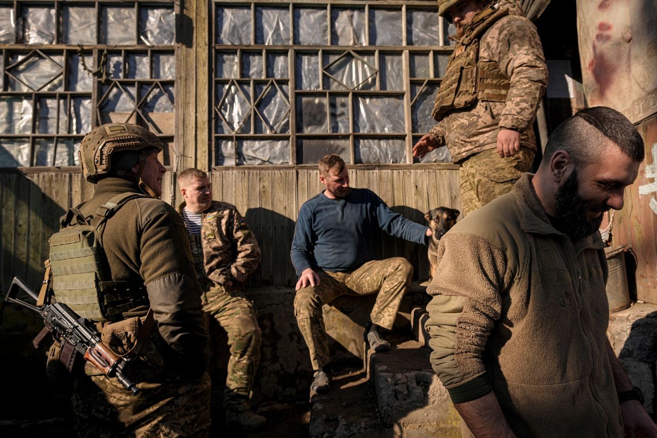 Ukrainian service members talk at a front-line position in eastern Ukraine on February 14. 