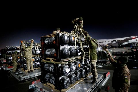 Ukrainian service members unpack Javelin anti-tank missiles that were delivered to Kyiv on February 10 as part of a US military support package for Ukraine.