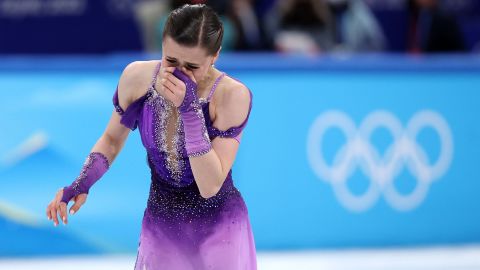 Valieva reacts after skating during the women single skating short program.