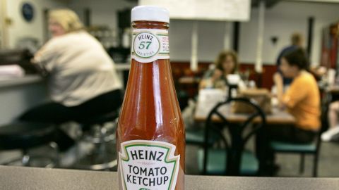The orginal purpose of the label on the neck of the Heinz ketchup bottle was to draw more attention to the "57 varieties" slogan, according to the Heinz History Center.
