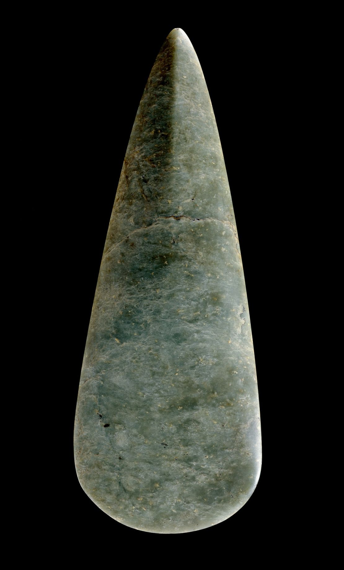 This finely worked jadeite ax-head was made from material quarried in the high Italian Alps 6,500 to 5,500 years ago. It would have belonged to some of the first farmers to arrive in Britain.