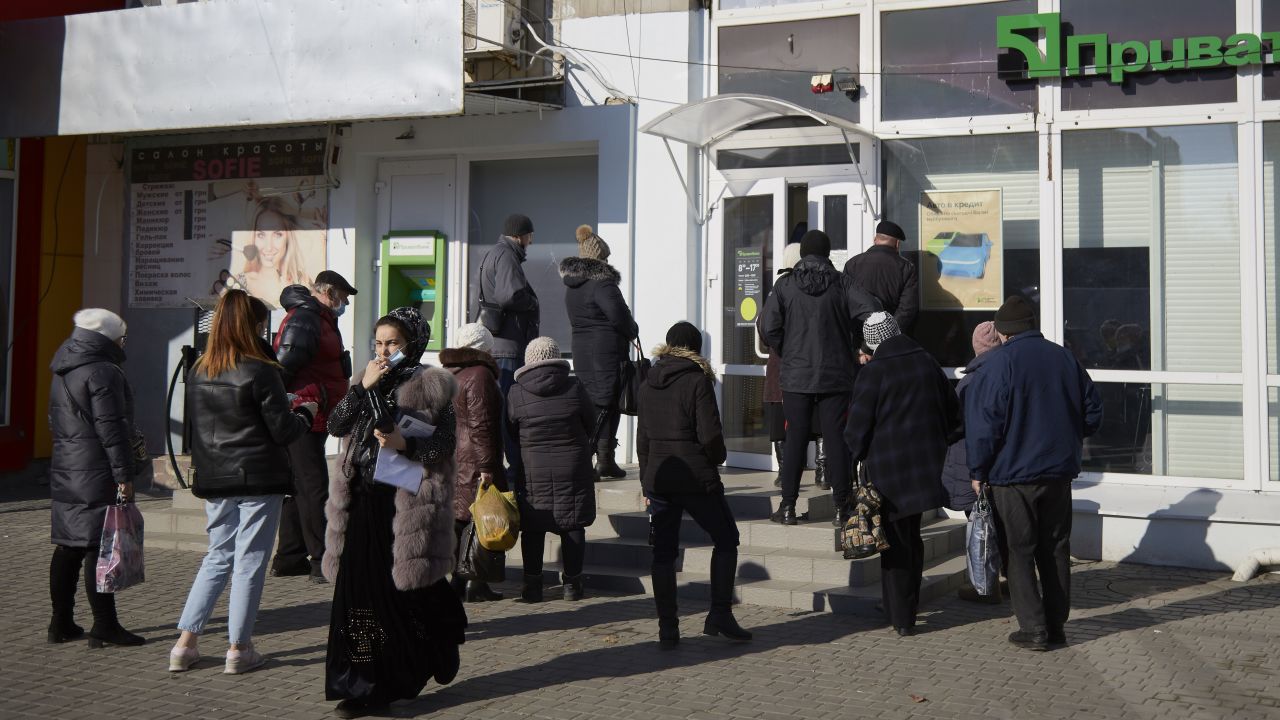 Residents wait outside the Ukrainian bank PrivatBank, which was hit by a cyberattack Tuesday.