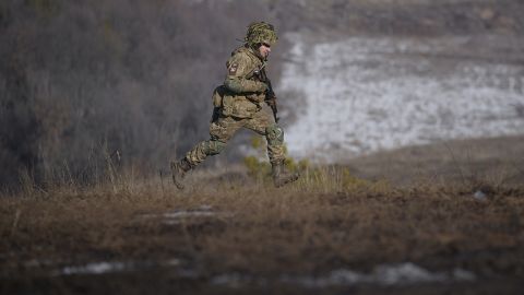 A Ukrainian serviceman runs during an exercise in the Joint Forces Operation, in the Donetsk region, eastern Ukraine, Tuesday, Feb. 15, 2022. 