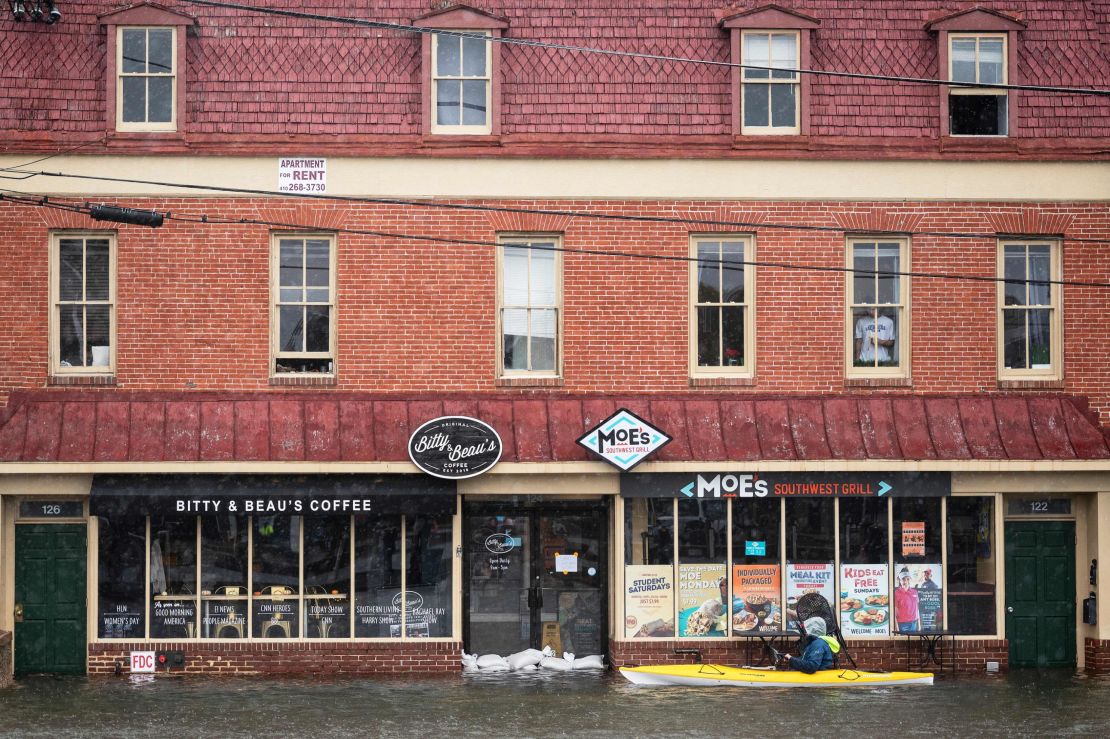 A man kayaks through high-tide flood waters in downtown Annapolis, Maryland, on October 29, 2021.