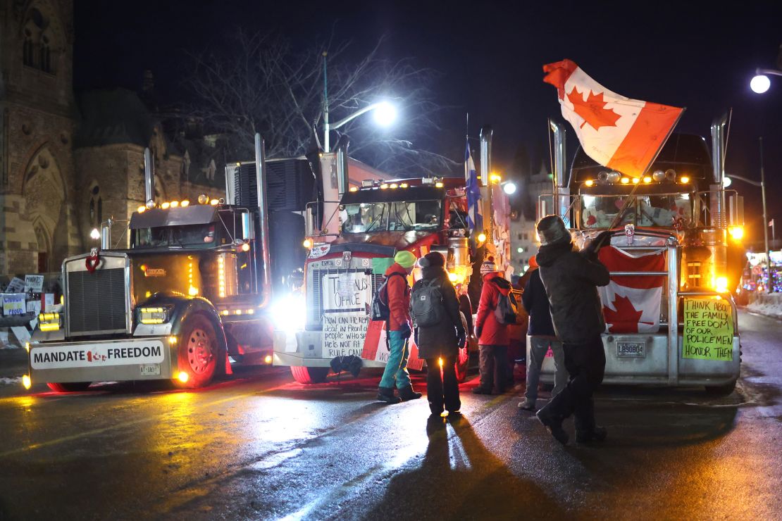 Trucks and protesters block downtown streets near the Parliament Buildings as a demonstration continues Wednesday in Ottawa, Ontario.