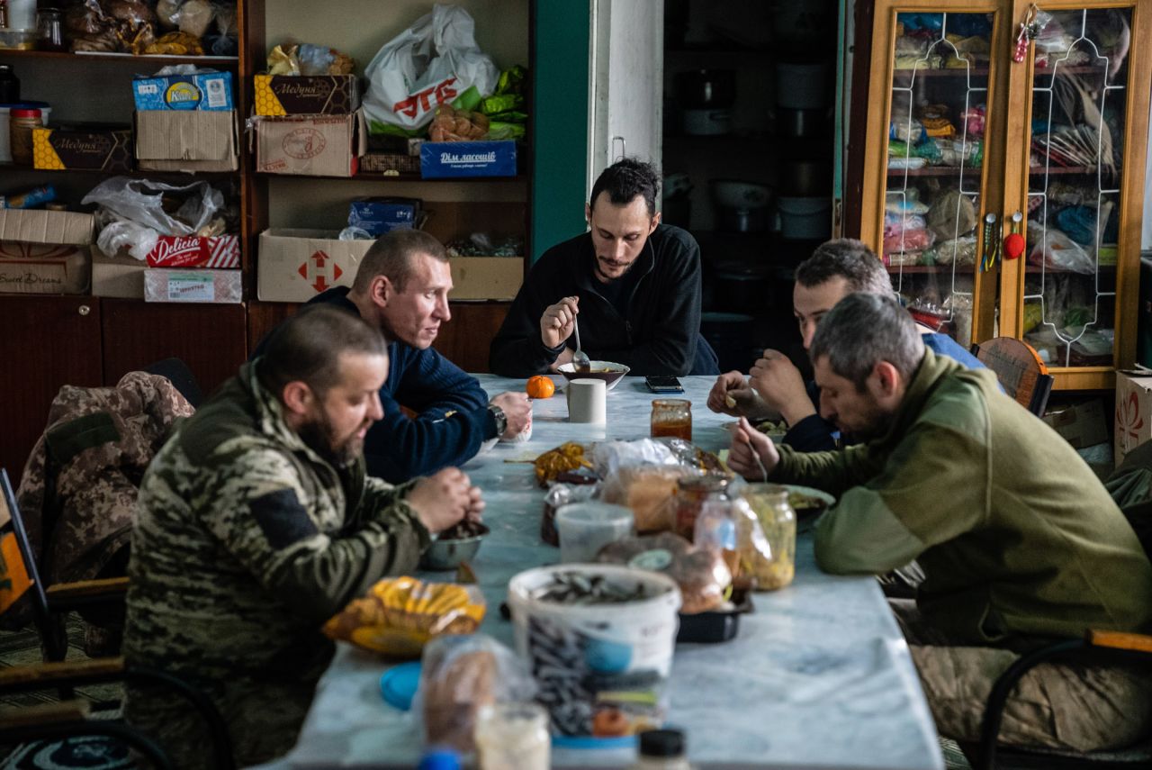 Fighters with the Right Sector, a paramilitary organization that has also become a political party, eat lunch at the group's headquarters in Novohrodivka, Ukraine. The Right Sector formed in 2013 during the Maidan revolution in Kyiv, and in 2014 and 2015 it fought many battles against Russian-supported separatists.