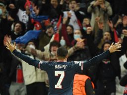 Paris Saint-Germain's French forward Kylian Mbappe celebrates after scoring the winner against Real Madrid.
