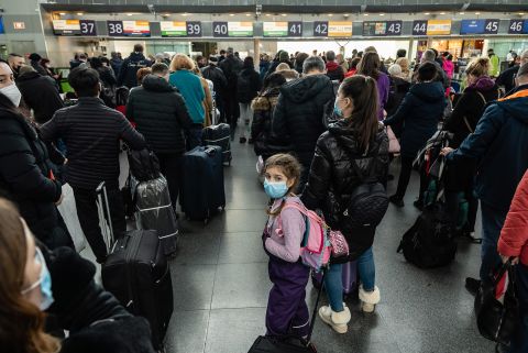 Travelers wait in line to check in to their departing flights February 15 at the Boryspil International Airport outside Kyiv. US President Joe Biden urged Americans in Ukraine to leave the country, warning that 