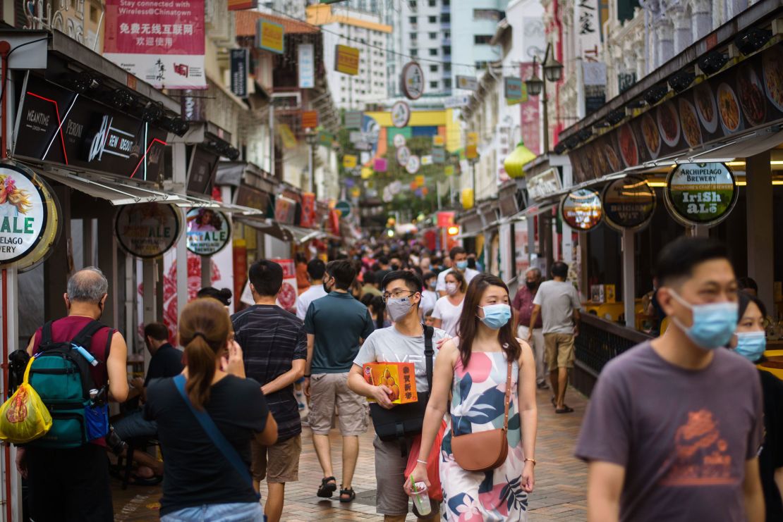 People walk in the Kreta Ayer district of Singapore ahead of the Lunar New Year on January 29.