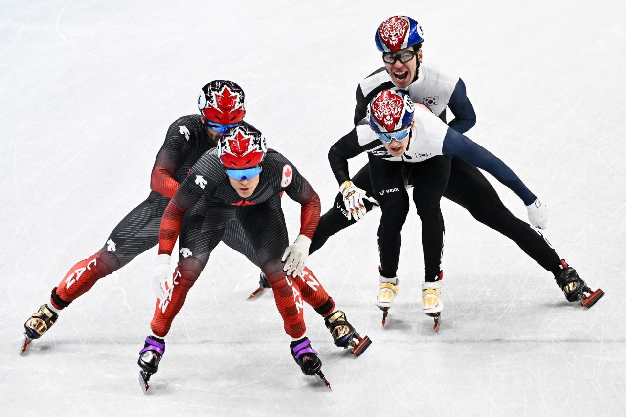 From left, Canada's Charles Hamelin and Jordan Pierre-Gilles and South Korea's Hwang Dae-heon and Park Jang-hyuk compete in the final of the 5,000-meter short track relay race on February 16. Canada finished first ahead of South Korea and Italy.