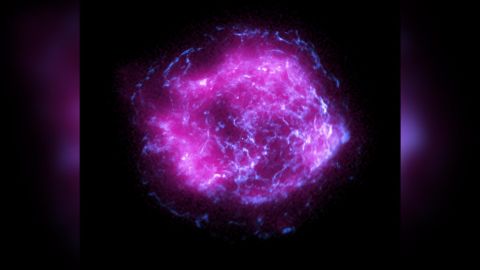 This image shows supernova remnant Cassiopeia A, combining the first X-ray data collected by NASA's Imaging X-ray Polarimetry Explorer in purple, with high-energy X-ray data from NASA's Chandra X-Ray Observatory in blue.