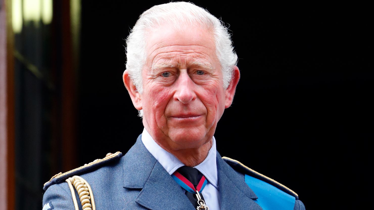 Prince Charles watches a Spitfire and Hurricane fly-past from the balcony of Church House on September 19, 2021 in London, England.